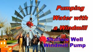 Windmill pumping water from a shallow well Windmill pumping water from a shallow well